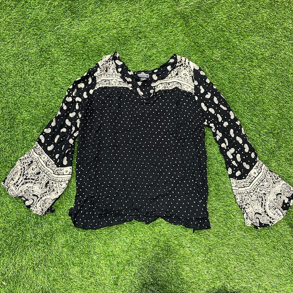 Ladies black and cream paisley and polka dot top with bell sleeves.